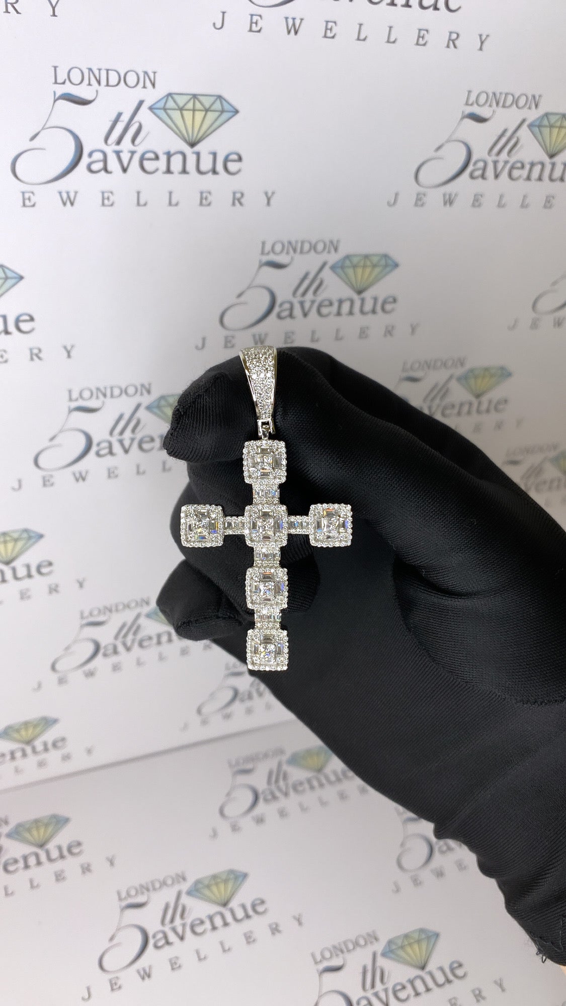 Iced out silver cross pendant