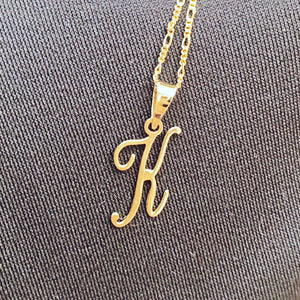 Fancy font gold initial pendant
